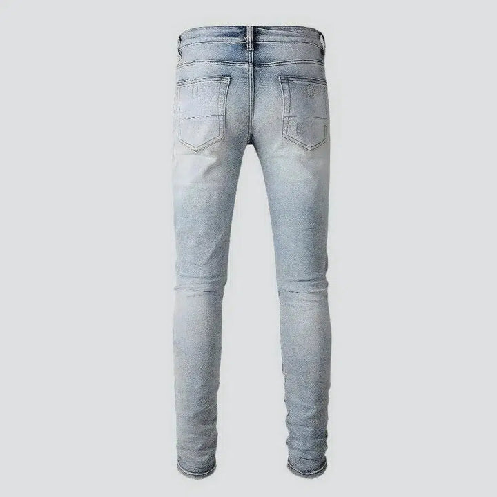 Light-wash distressed jeans